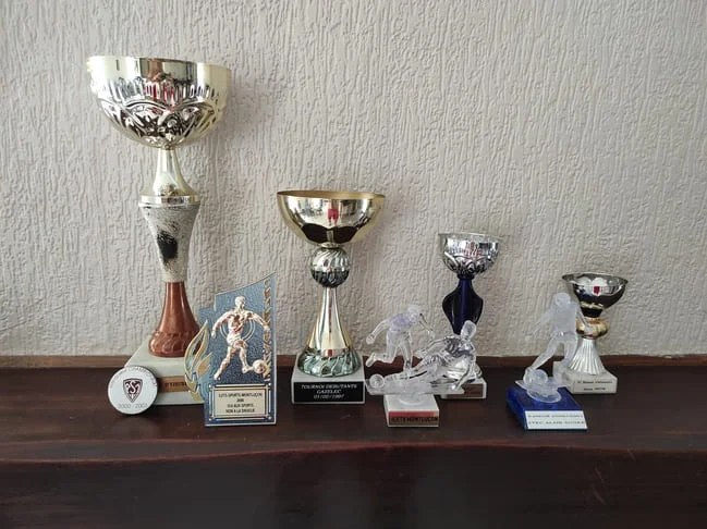 Coupes et récompenses de football, Papa Muscle