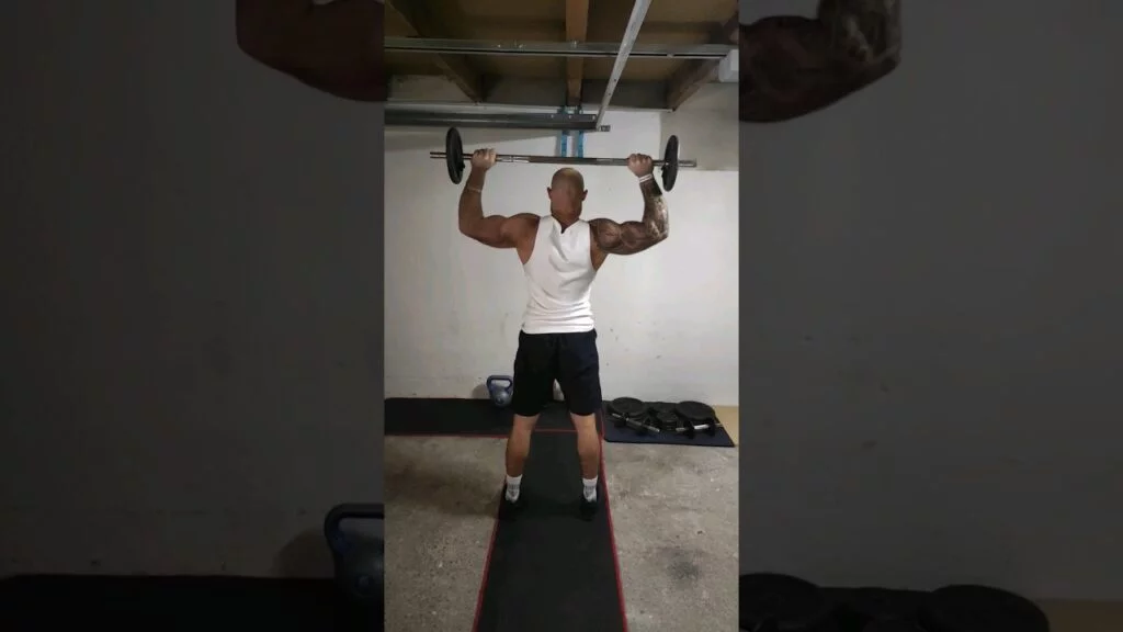 Développé nuque debout barre (standing barbell behind the neck shoulder press)