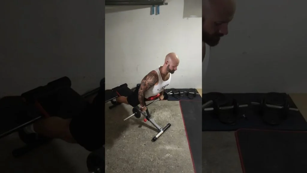 Extension lombaire banc à 45° barre (barbell incline back extension)