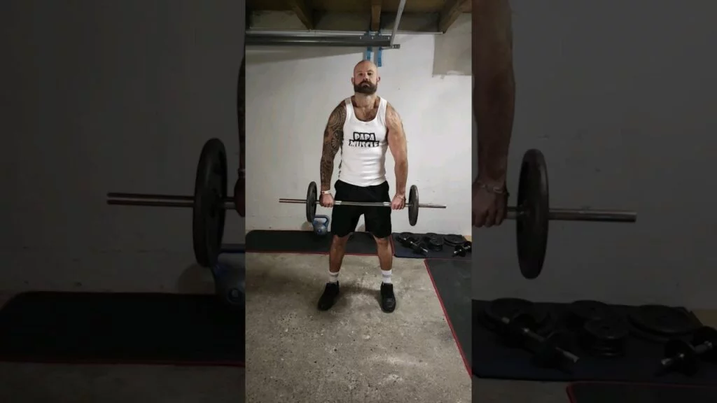 Shrug à la barre (barbell shrug)