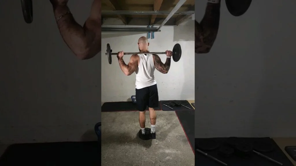 Extension mollet debout barre Ă 1 jambe (standing barbell one leg calf raise)