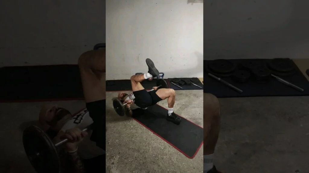 Relevé de bassin marché barre (barbell glute bridge march)