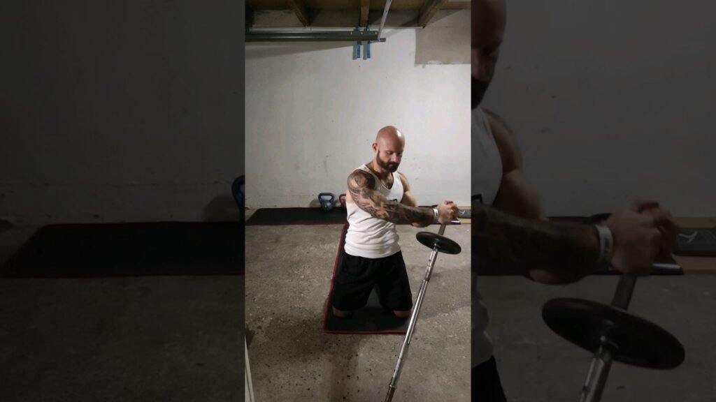 Rotation buste Ă genou landmine (landmine oblique twist)