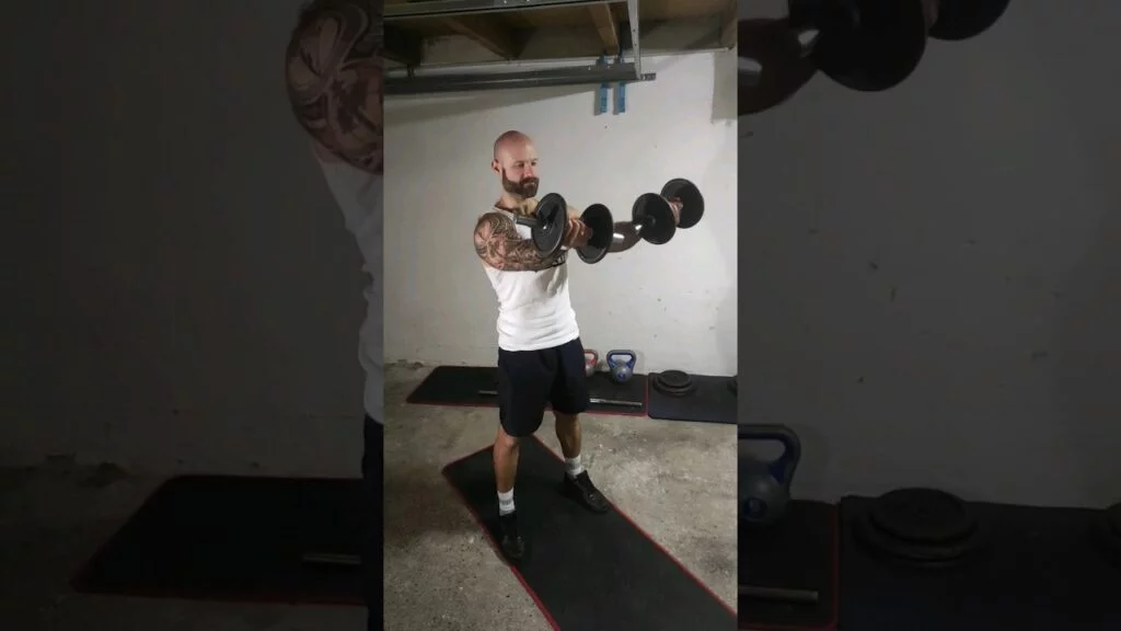 Élévation frontale debout haltère supination (standing underhand dumbbell front raise)